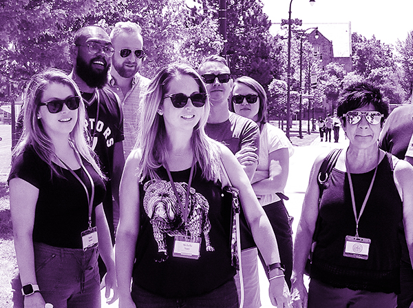 Group of mature learners outside on Queen's campus.