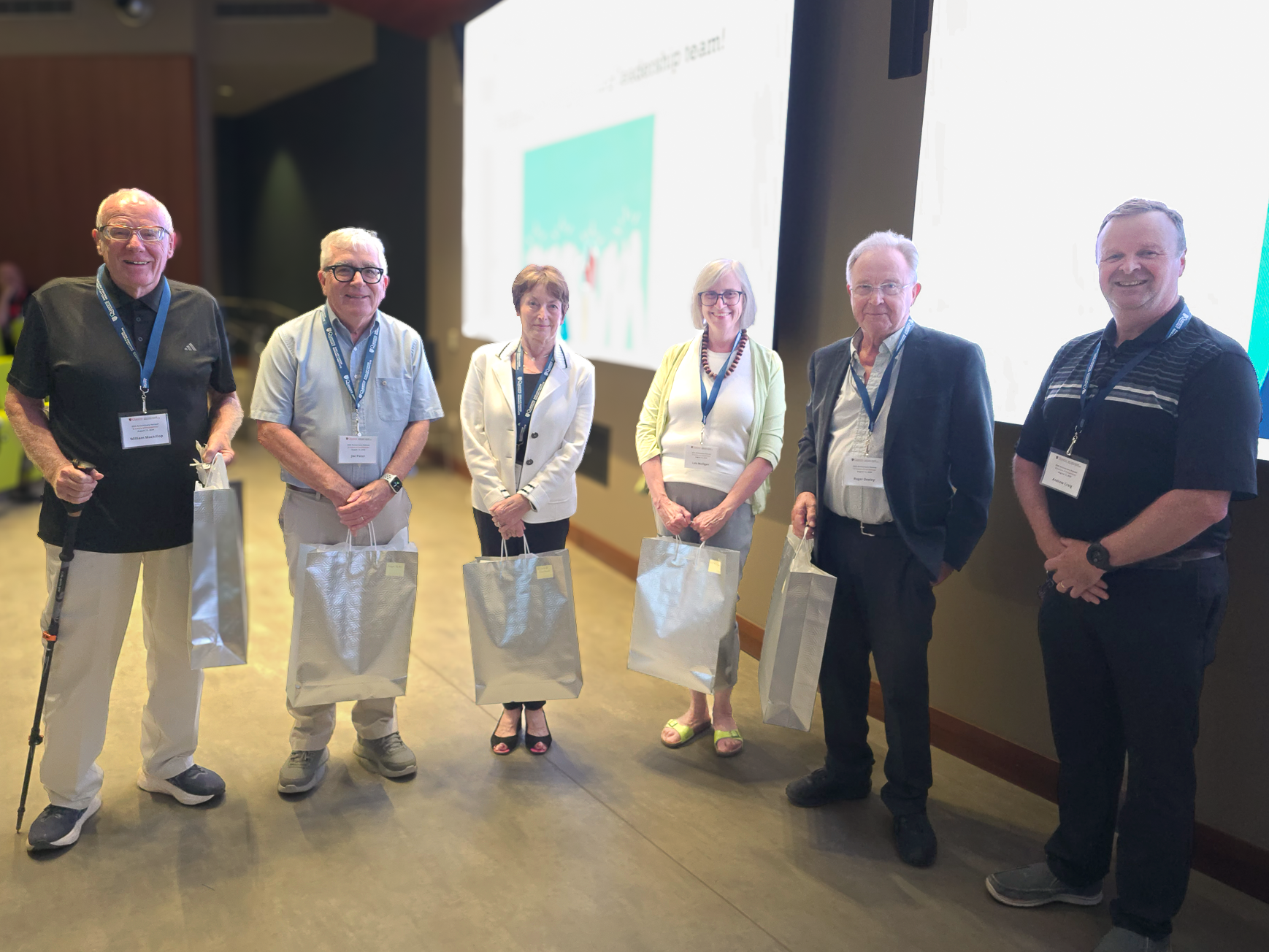 The founders of the Queen’s Cancer Research Institute reunite with current SCRI Director Dr. Andrew Craig at the 2026 Annual Retreat.