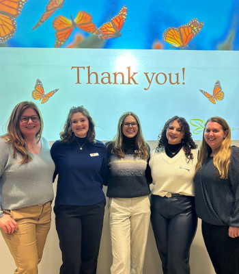 Group photo of Katie Goldie, Katie Browne, Cassie Wilson, Aileen Gencturk and Marnie Chapmen smiling at the camera
