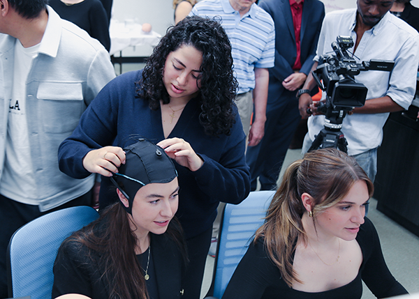 Students using electroencephalography headset in lab