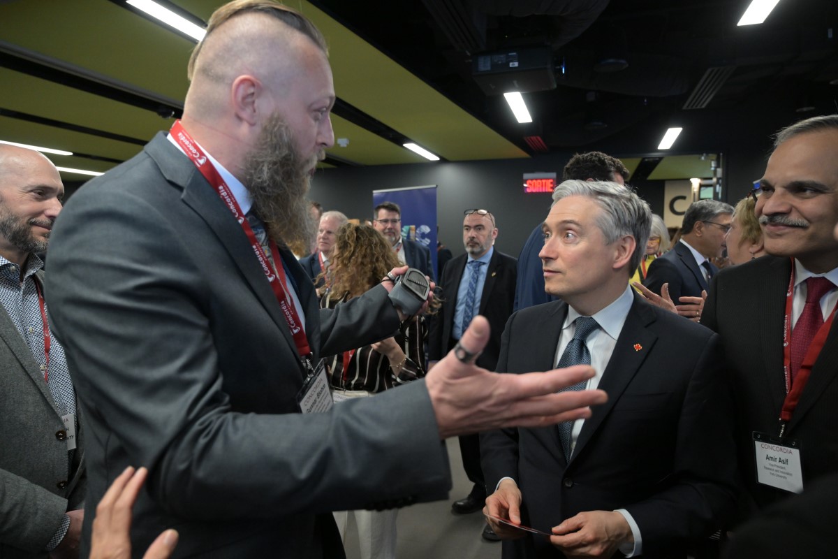 Gunnar Blohm speaks with François-Philippe Champagne, Canada's Minister of Innovation, Science and Industry, following the CFREF announcement. (Supplied Photo) 