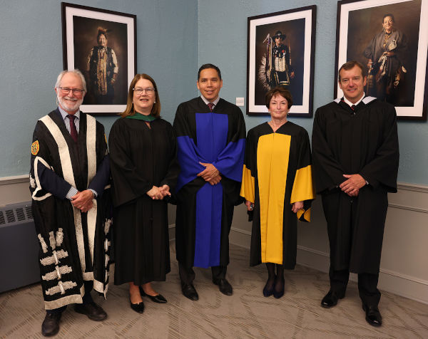 Natan Obed with Queen's leadership