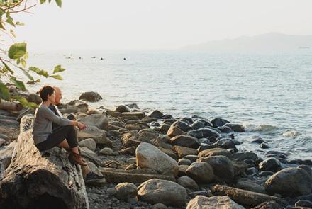 Cara and Murray Sinclair sitting by a lake