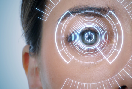 close up of one person's right eye with a tech screen overlay 